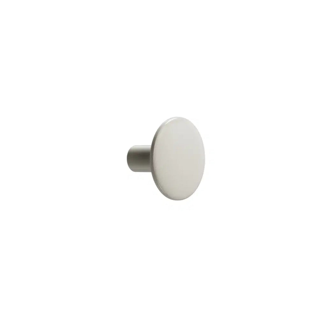 White circular cabinet knob on white background