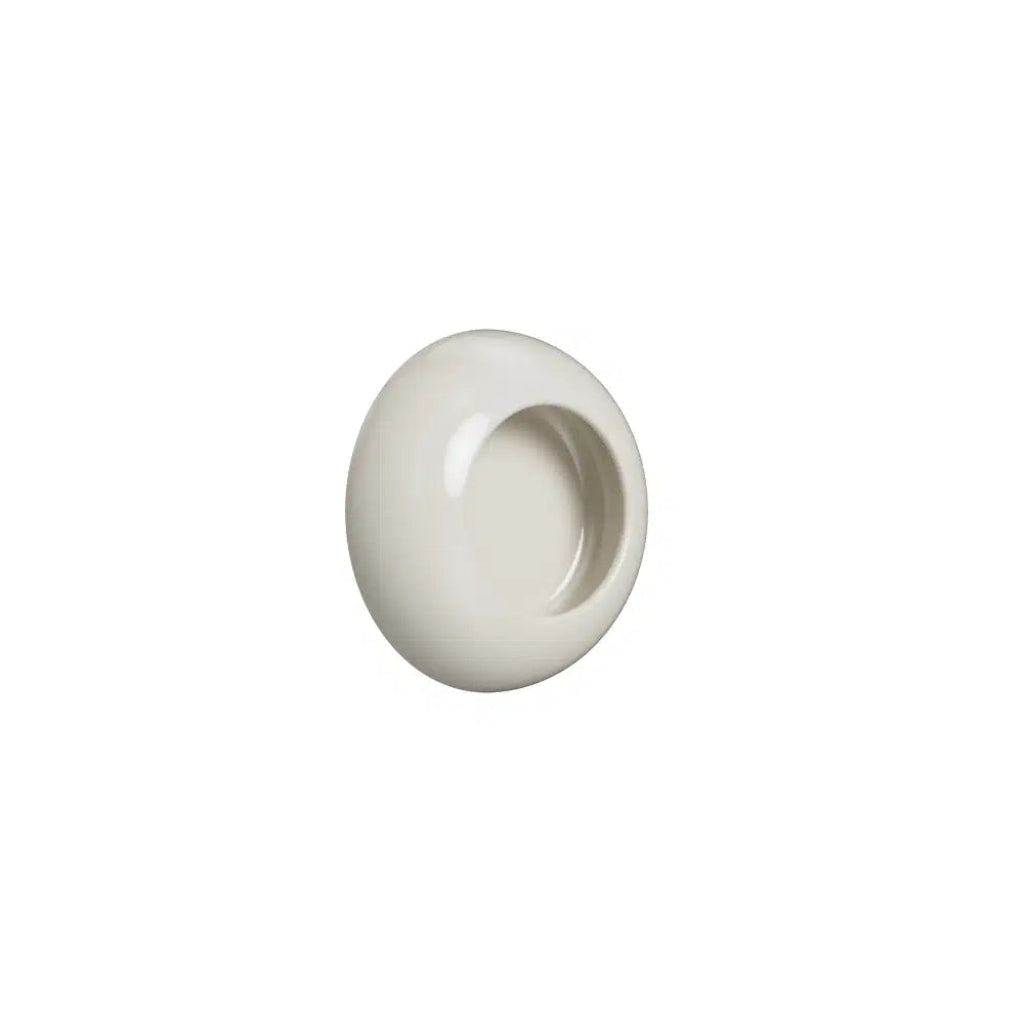 White cup-style cabinet knob on white background