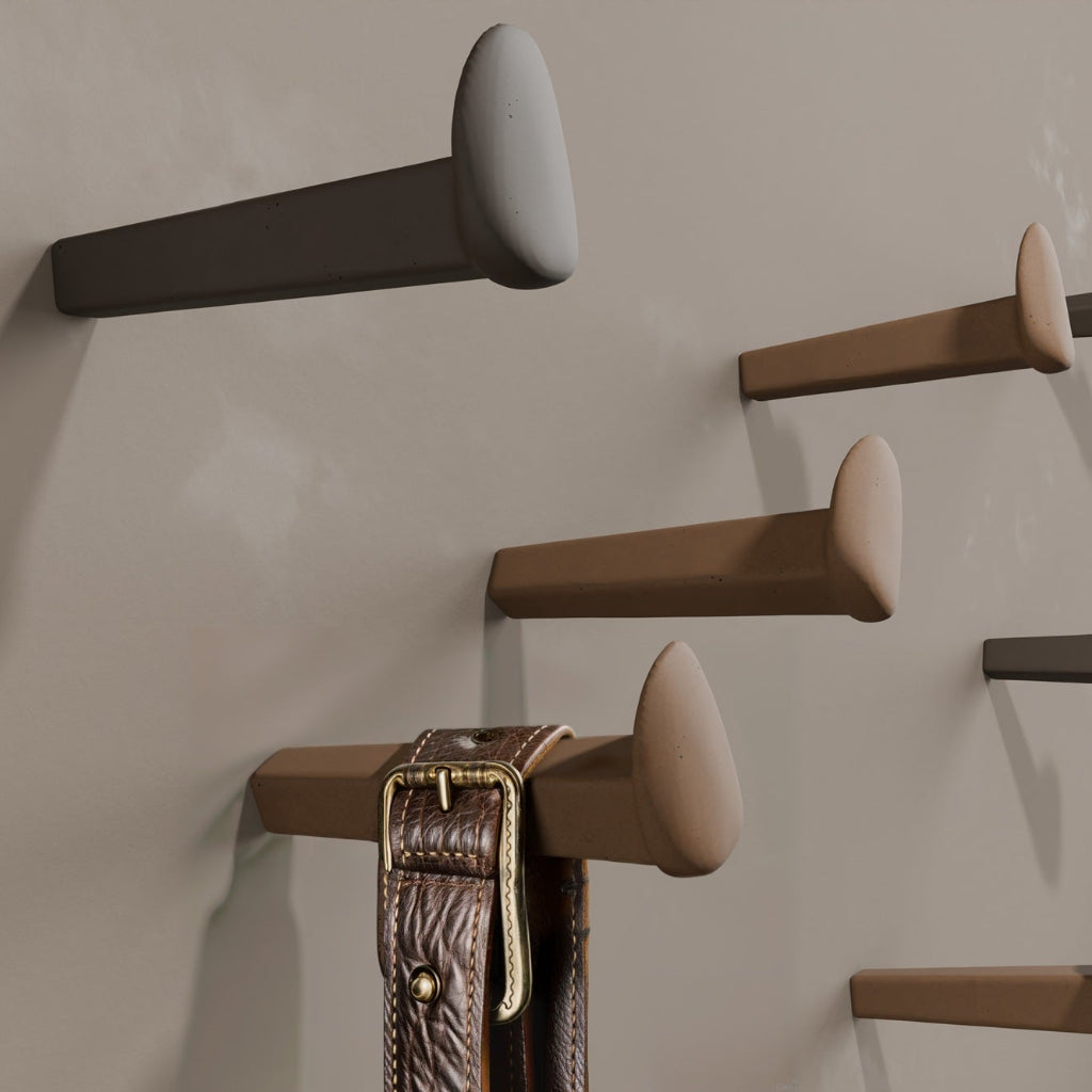 Gantzos concrete wall hook inspired by traditional forged nails. A minimalist, handcrafted design with natural texture and sculptural character.