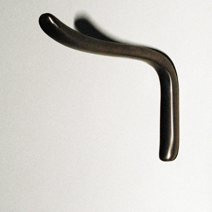 L shaped hook in dark brass.