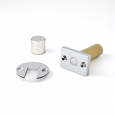 A couple of Ghostop Concealed Door Stops GS300 on a white surface.