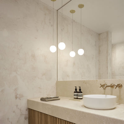 A bathroom with an Anony Glass 120 Pendant sink and mirror.