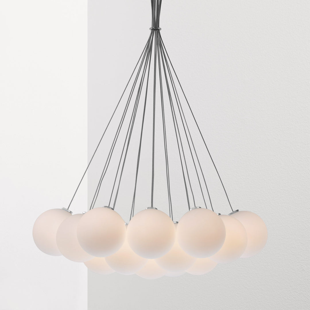 An Anony Glass 120R Pendant with five white balls hanging from it.