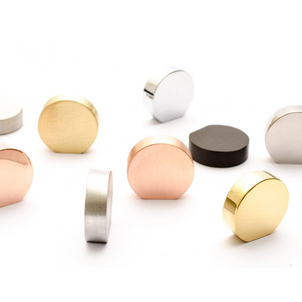 A group of Baccman Berglund's Globe Knob rings on a white surface.