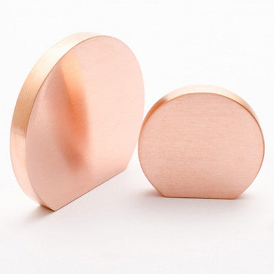 Beautiful semi circular shaped knobs. In solid brushed copper and various other finishes.