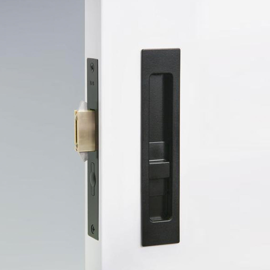A close up of a Halliday Baillie HB 690 Flush Pull Privacy Lock on a white door.