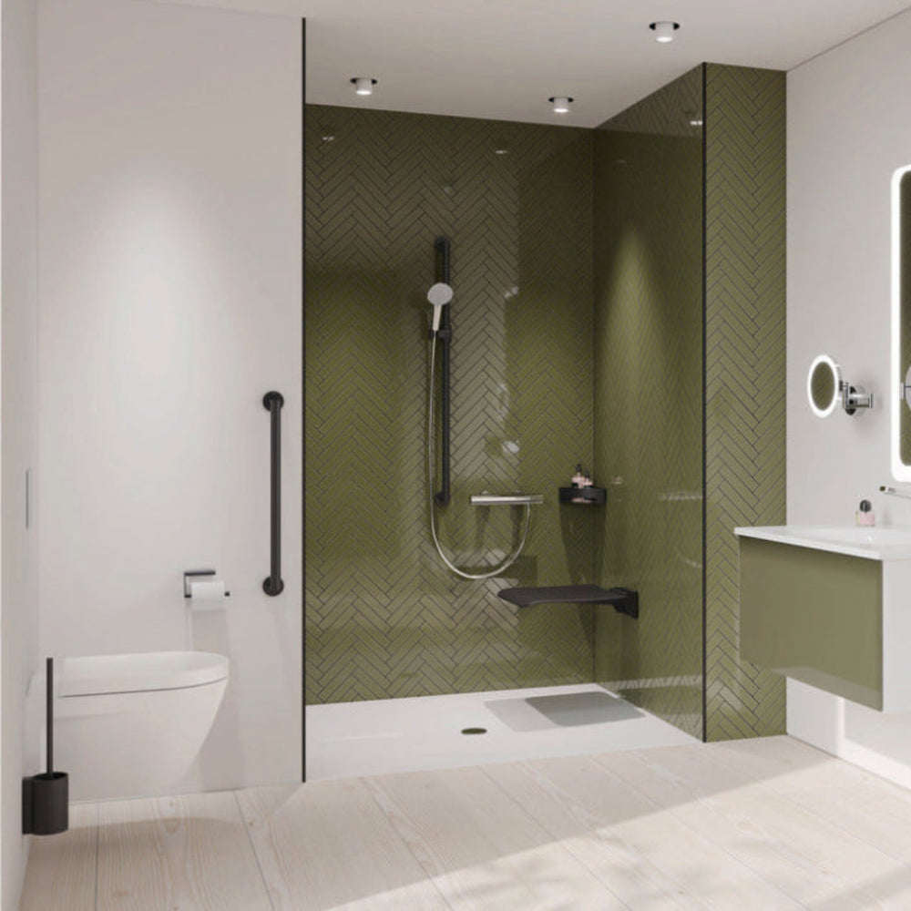 Modern bathroom with a shower area featuring green tiles and black fixtures.