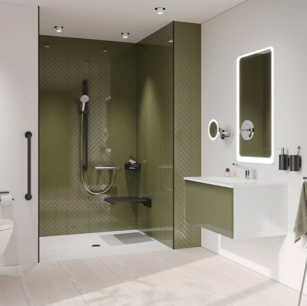 A bathroom with a green wall and Hewi 900 shower fittings.