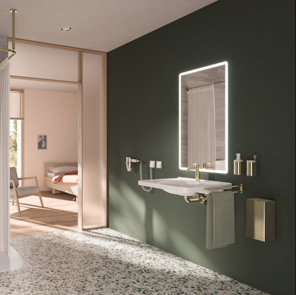 A green-walled bathroom with a Hewi mirror and basin.