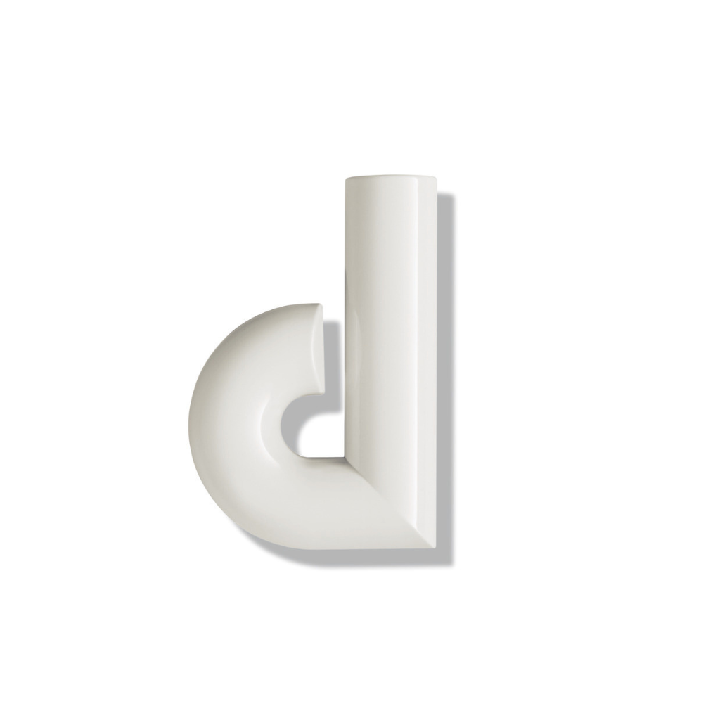 Cream Hewi house letter d, a rounded sans-serif character for wall mounting.