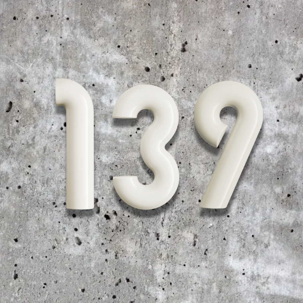 Bubbly White house numbers '139' on a concrete surface