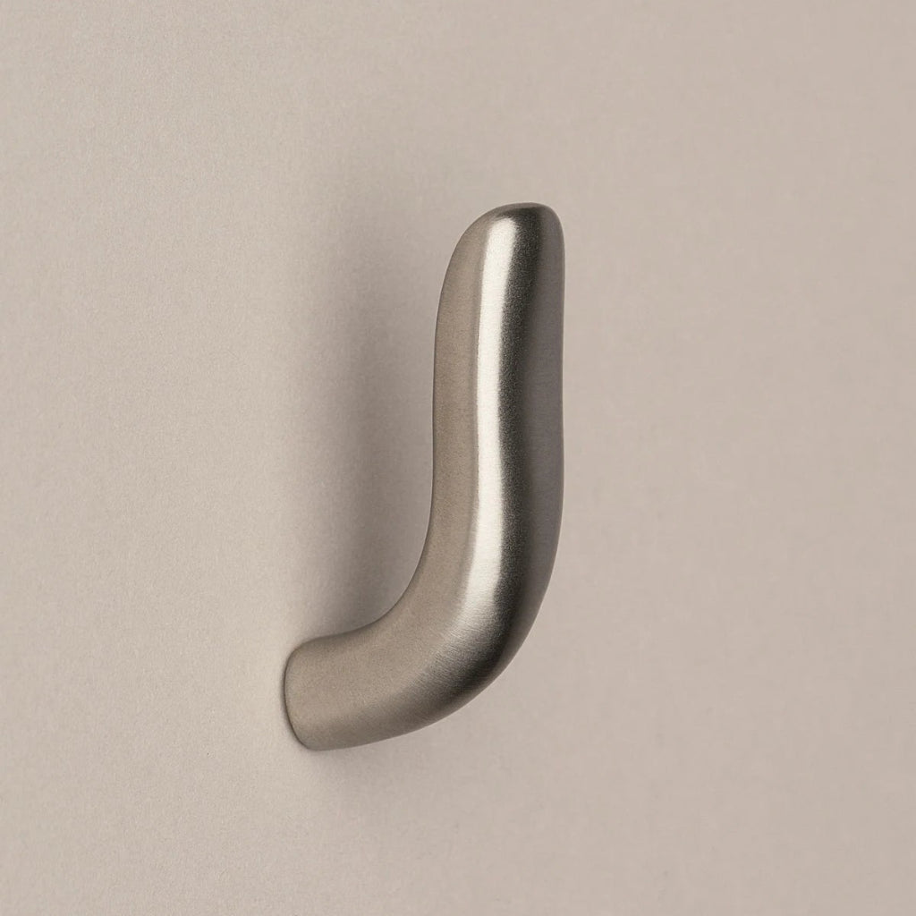 Softly curved J shaped hook in satin nickel, side view.