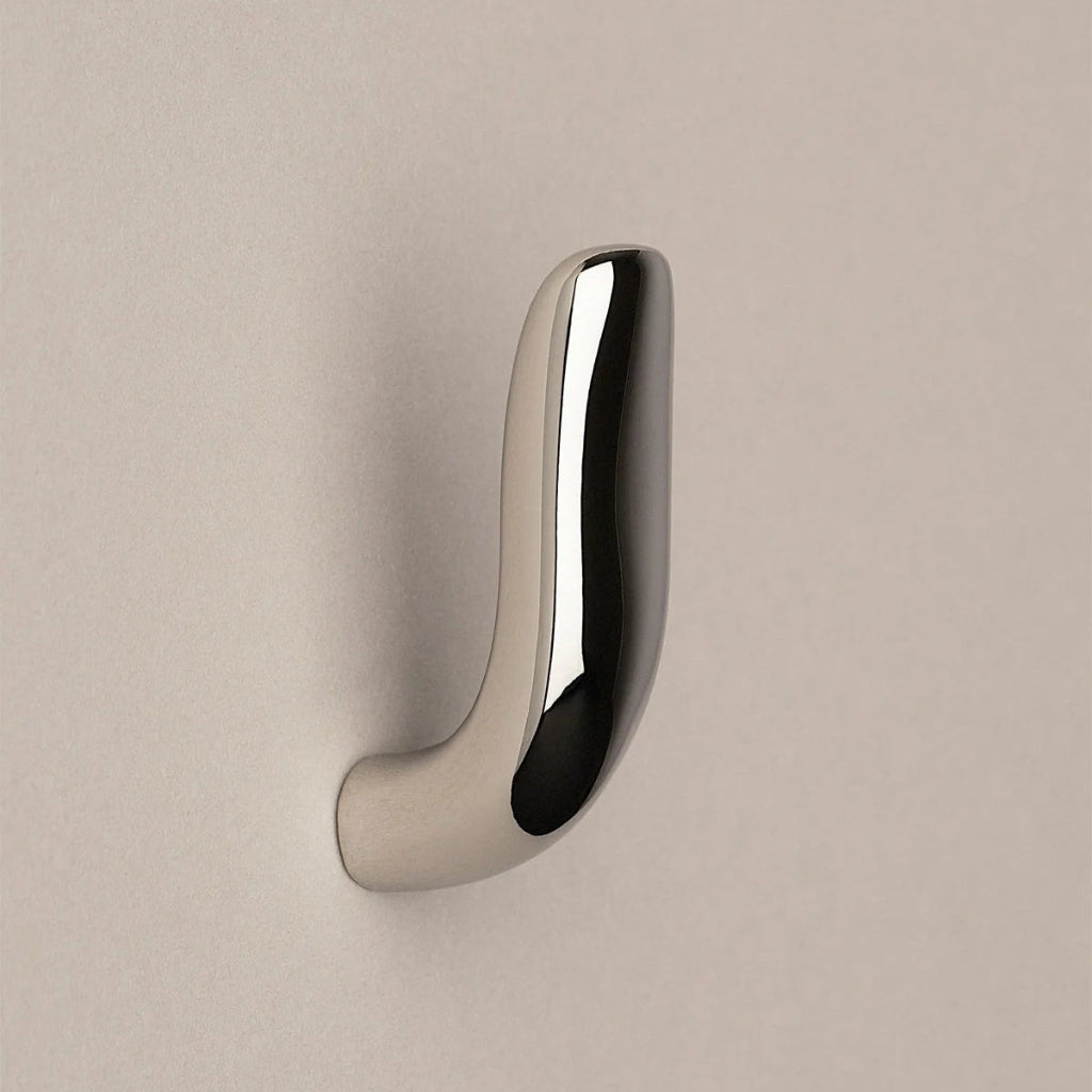 Softly curved J shaped hook in polished nickel, side view.