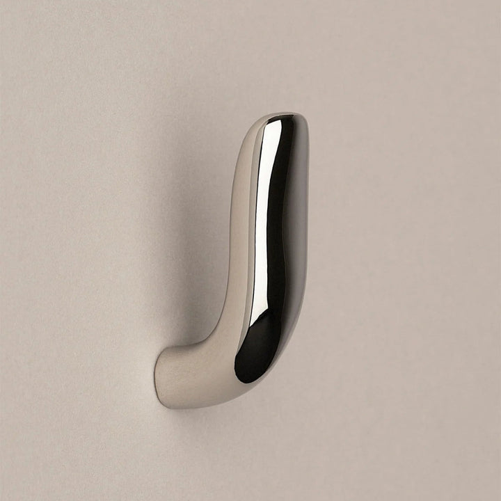 Softly curved J shaped hook in polished nickel, side view.