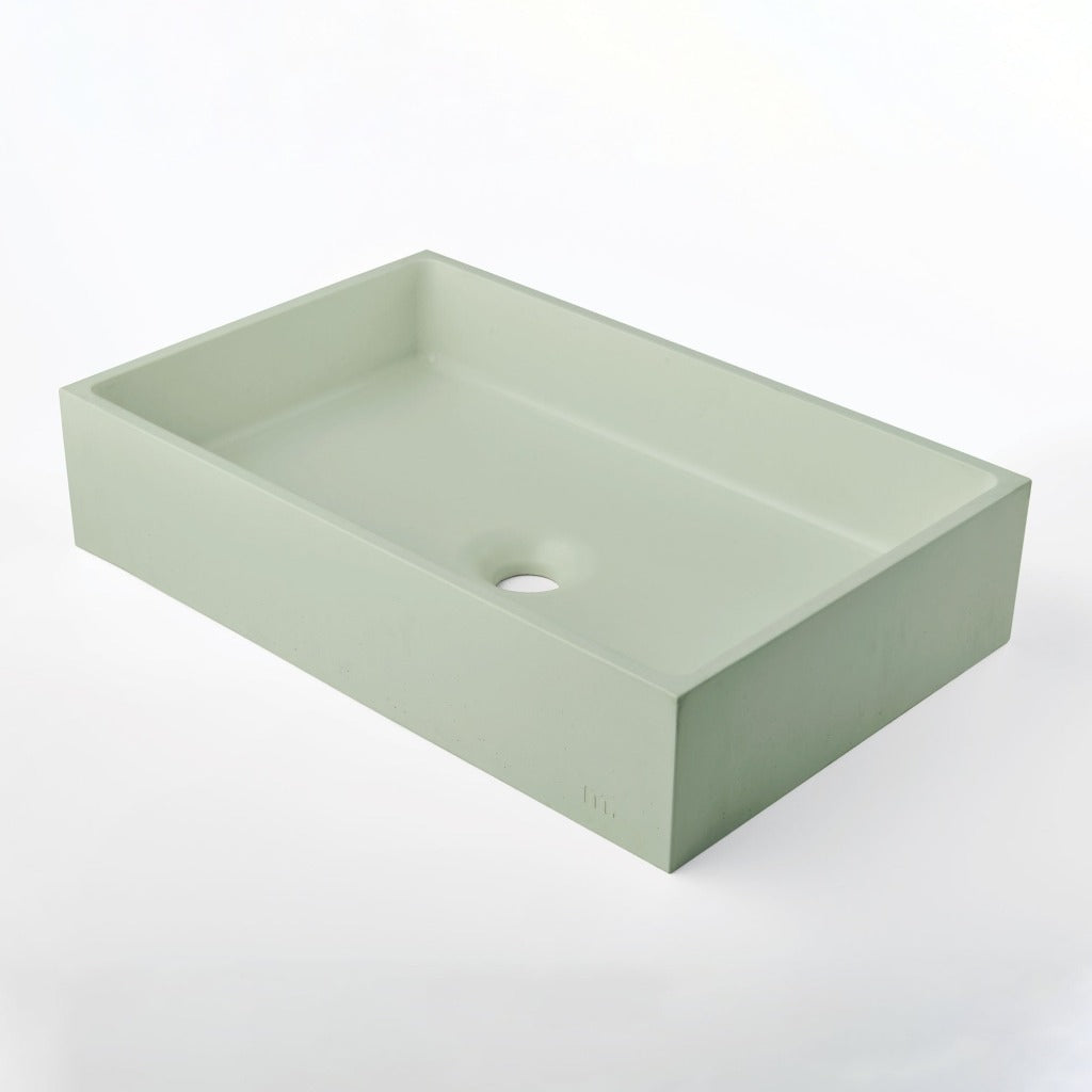 A Mudd. Concrete Jeker Basin sink on a white background.
