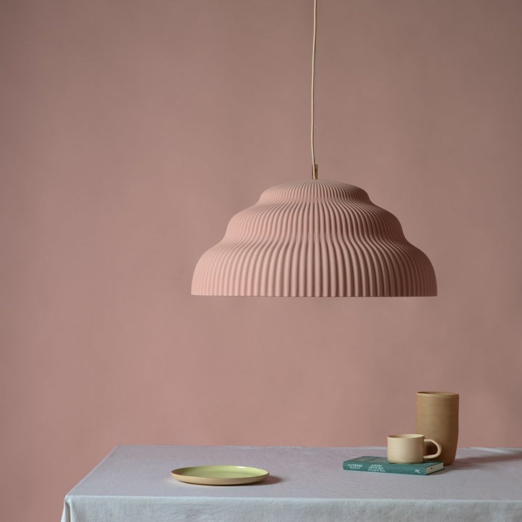 Ceramic pendant light, hand cast in Germany.