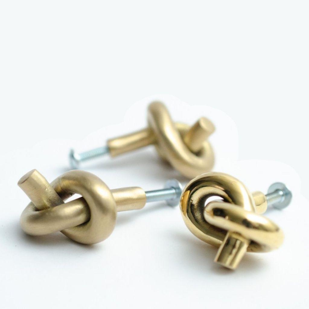 Baccman Berglund Brass Knot Knob uninstalled in a cluster