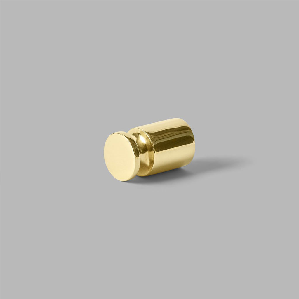 Knud Coat Hook in PVD polished brass shown on grey background
