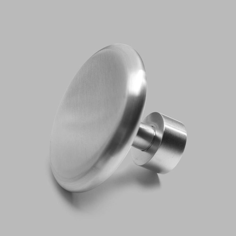 A dline knud coat hook in satin stainless steel.