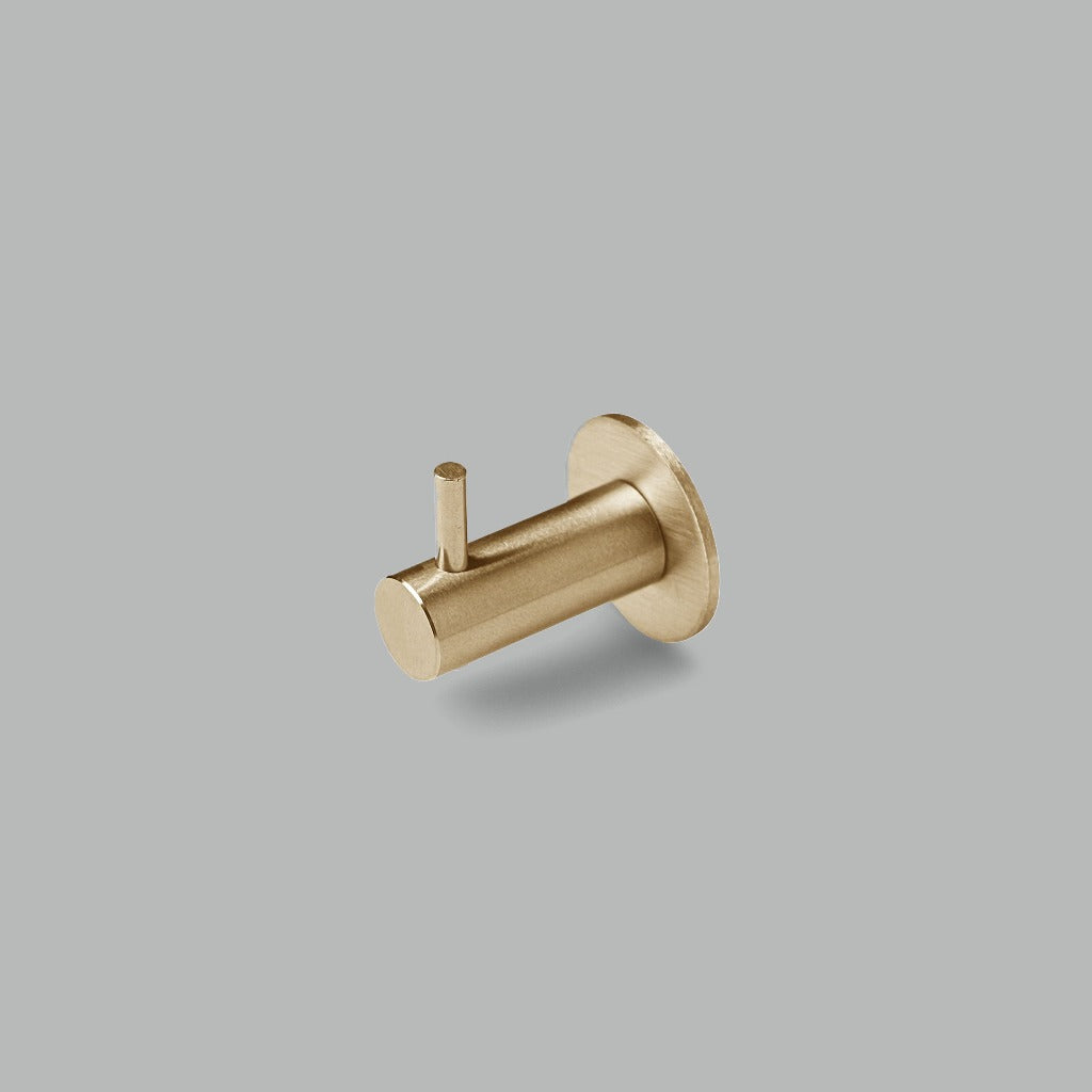 A dline knud coat hook with pin in satin brass