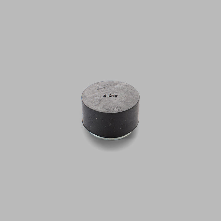 A d line Knud Floor Door Stop on a gray background.