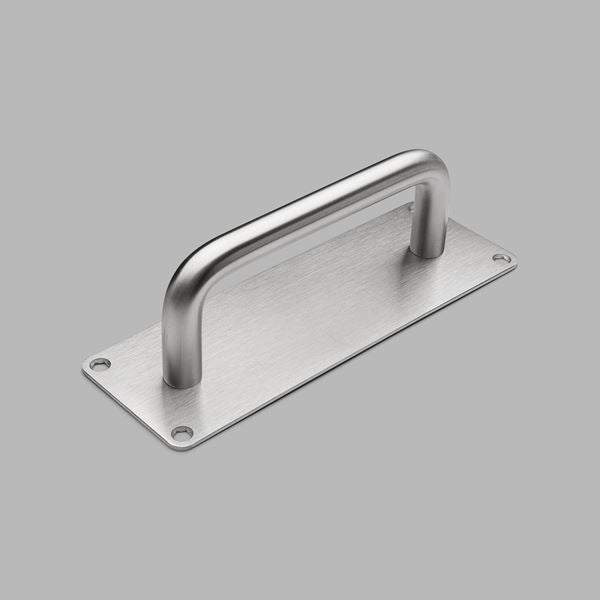 A d line Knud Straight Back Plate Cabinet Pull on a gray background.
