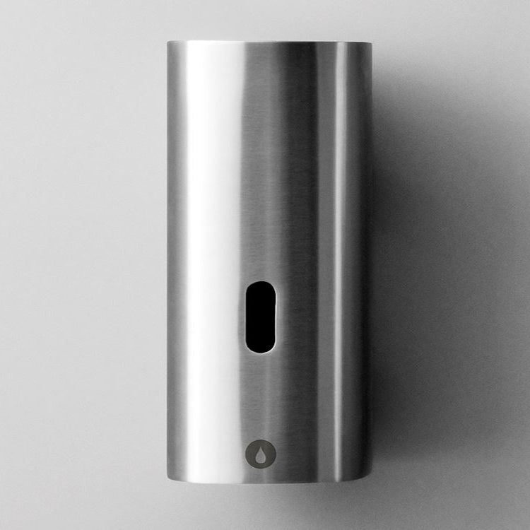 Knud Touchless Soap Dispenser, a classic fitting from the d line sanitary line. This modern and sleek dispenser is available in a variety of stylish finishes, including brass, copper, white, black, grey, and stainless steel.