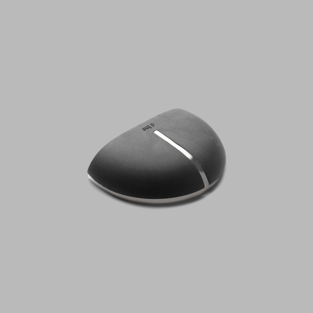 A computer mouse sitting on top of a gray surface.