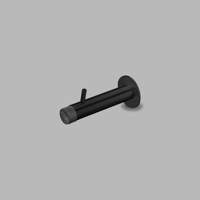 A d line Knud Wall Door Stop with Coat Pin on a gray background.