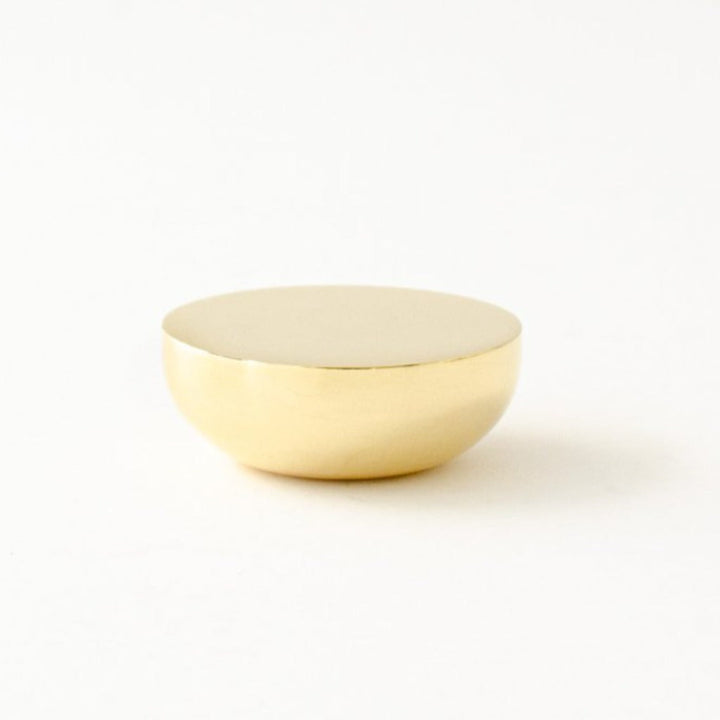 Round knob in polished brass by Baccman Berglund