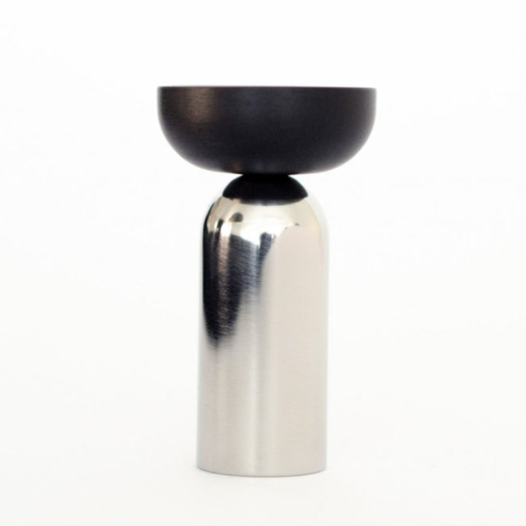 A Kokeshi Mix Hook by Baccman Berglund sitting on top of a white table.