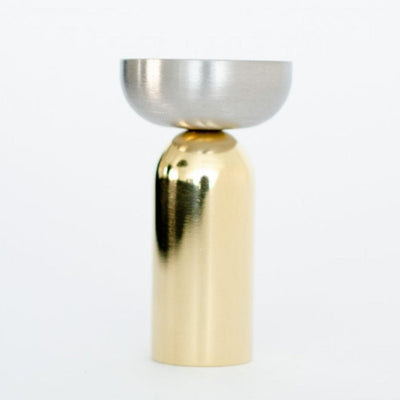 a Kokeshi Mix Hook candle holder in gold and silver by Baccman Berglund on a white background.