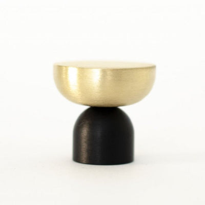 A small black and gold Baccman Berglund Kokeshi Mix Knob/Hook on a white background.