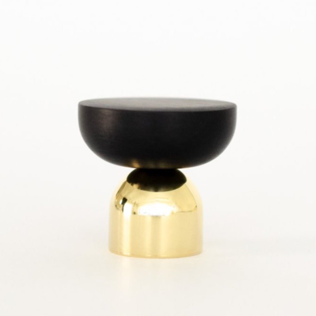 A Baccman Berglund Kokeshi Mix Knob/Hook in black and gold on a white background.