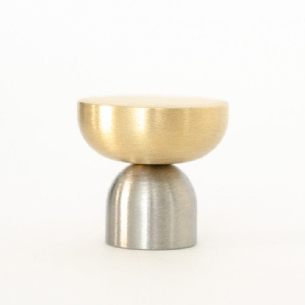 A Baccman Berglund Kokeshi Mix Knob/Hook with silver and gold accents on a white background.