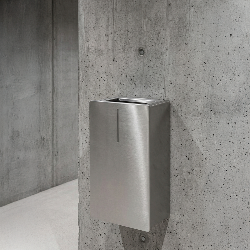 Coordinated Dan Dryer washroom showing hand dryer, dispenser, and sanitary bin in a single material language