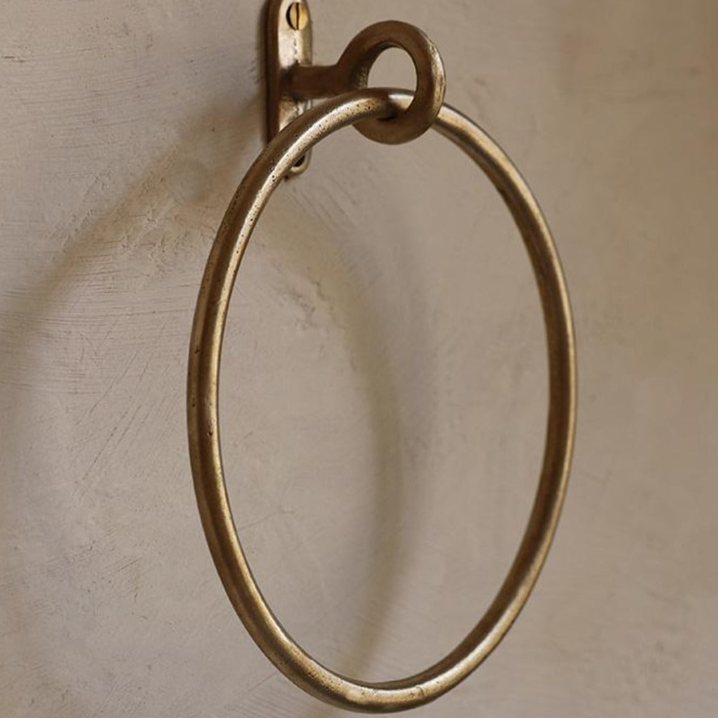 A close up of a Mi & Gei Libre Forme No. 13 Towel Ring on a wall.