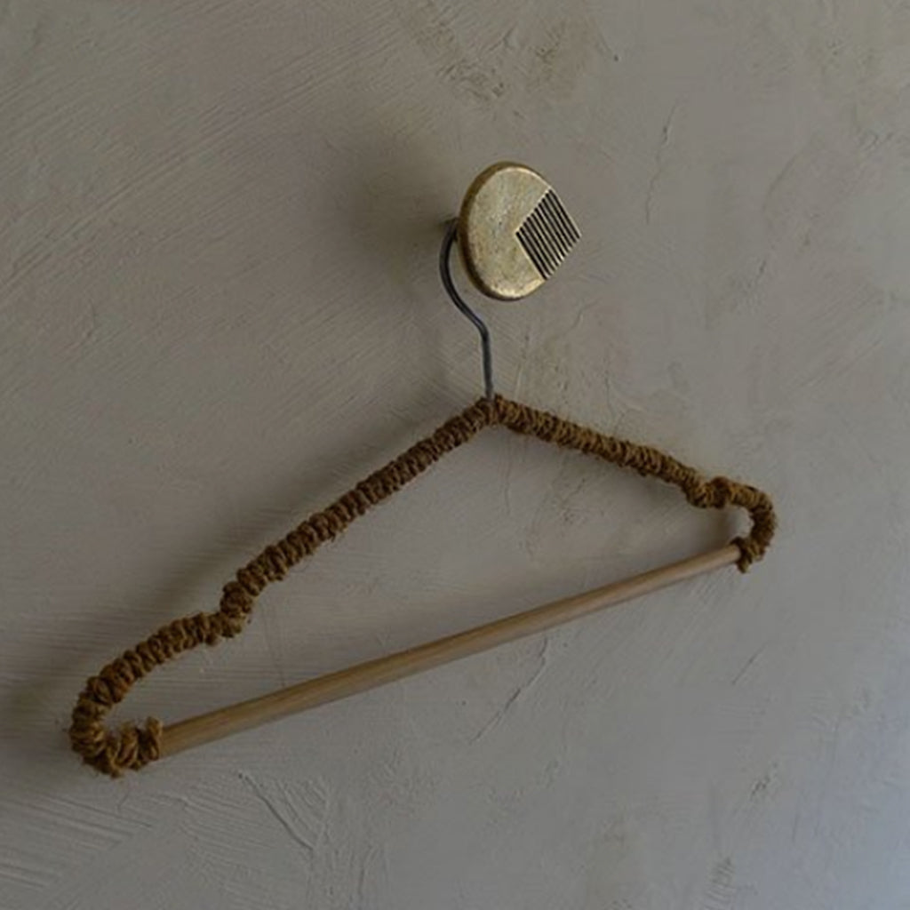 A Mi & Gei Libre Forme No. 6 Hook hanging on a white wall.