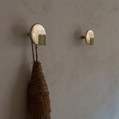 A couple of Mi & Gei Libre Forme No. 6 Hooks that are on a wall.