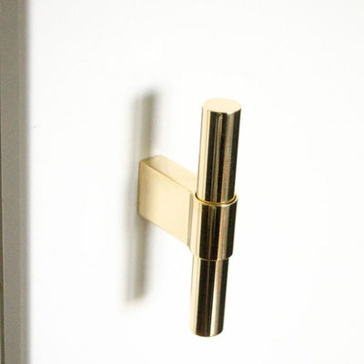A close up of a Baccman Berglund Line Big Knob on a white door.