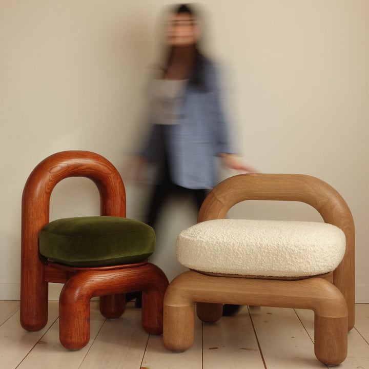 lithic lounge chair in red oak and natural oak side by side 