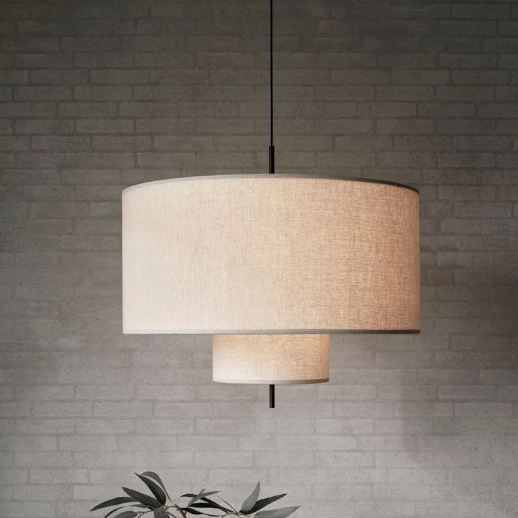 A round, tiered pendant lamp hung from ceiling