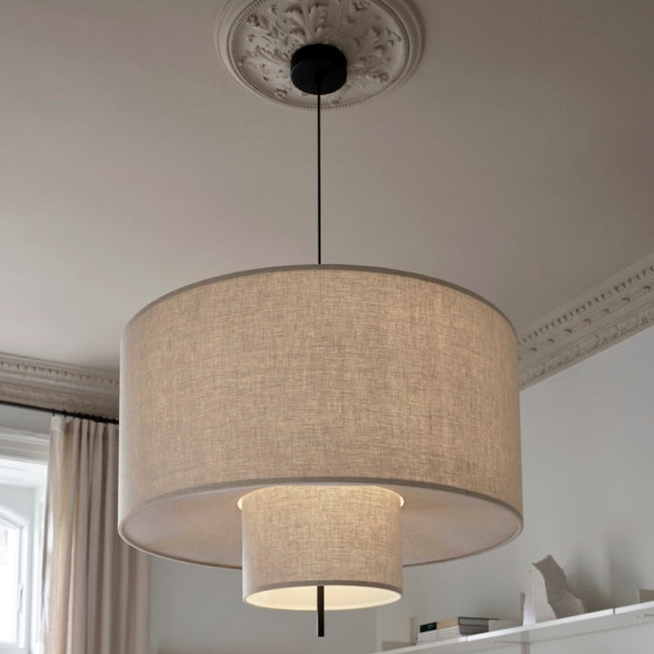 A round, tiered pendant lamp hung from ceiling