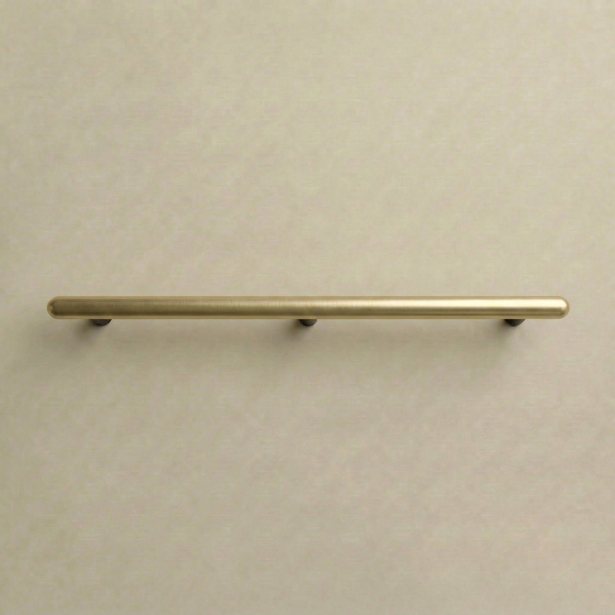 Satin brass Chapman & Bose Mineral metal appliance bar pull, a long round bar on posts.
