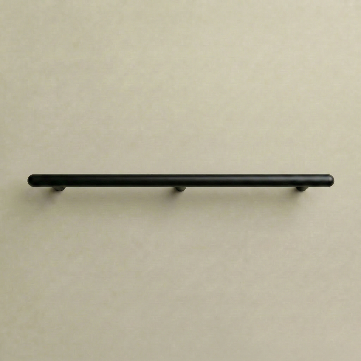 Matte black Chapman & Bose Mineral metal appliance bar pull, a long round bar on posts.