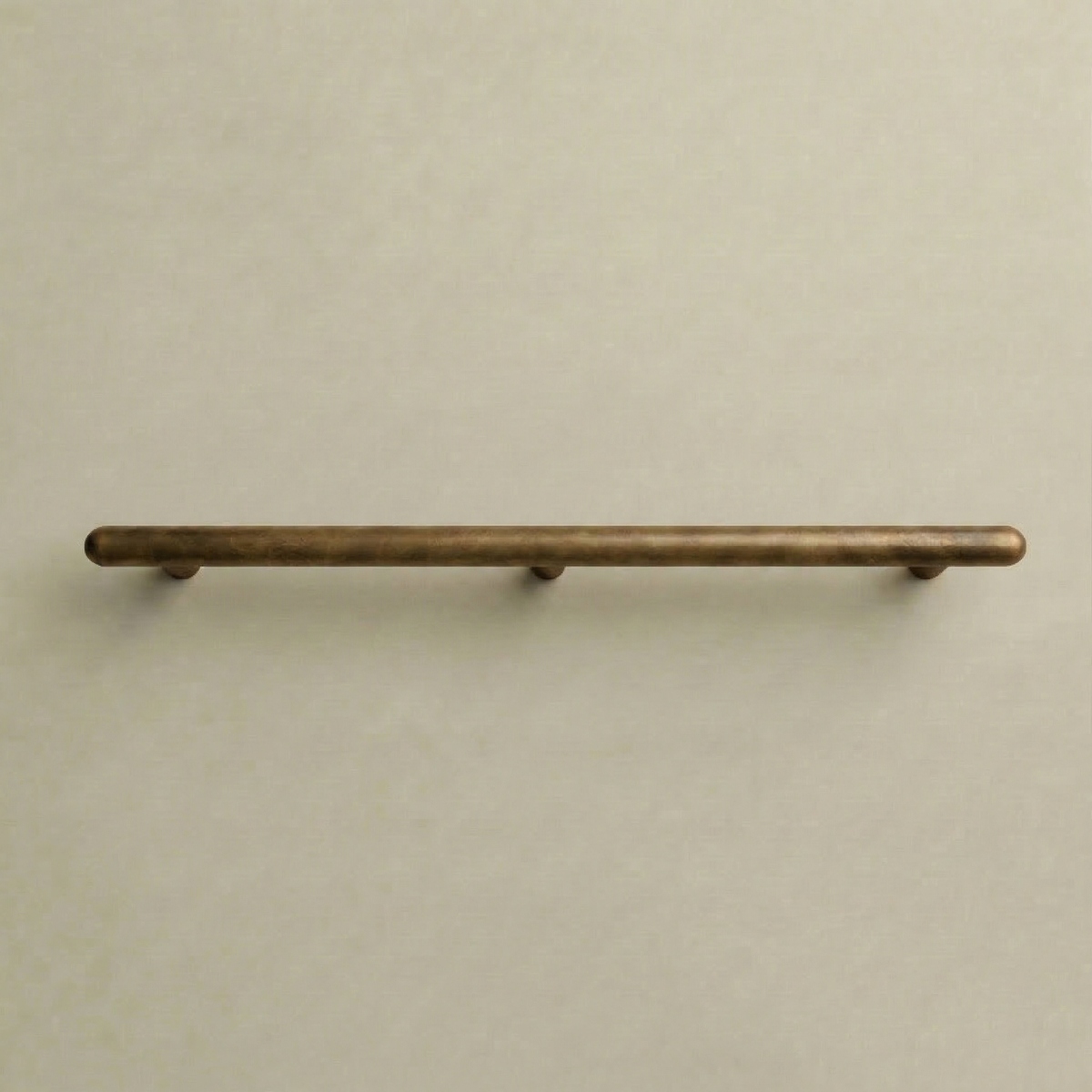 Satin brass Chapman & Bose Mineral metal appliance bar pull, a long round bar on posts.