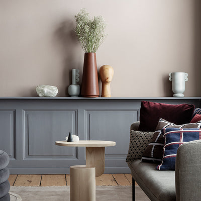 A living room filled with Ferm Living's Muses Vase Ania and other furniture.