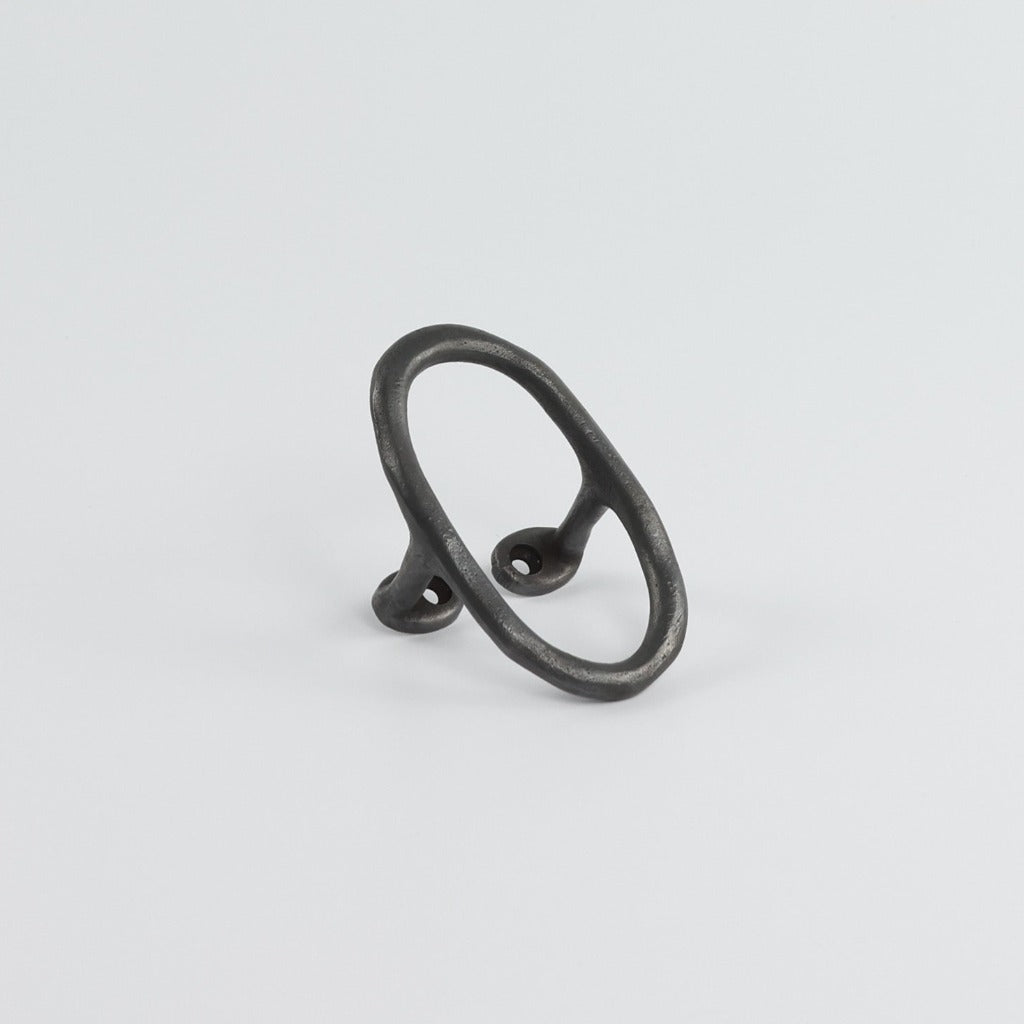 Carbon Black casting Libre Forme No. 7 wall hook, cabinet pull, or curtain tie back designed as Jewelry hardware collection by Mi&Gei Edition.