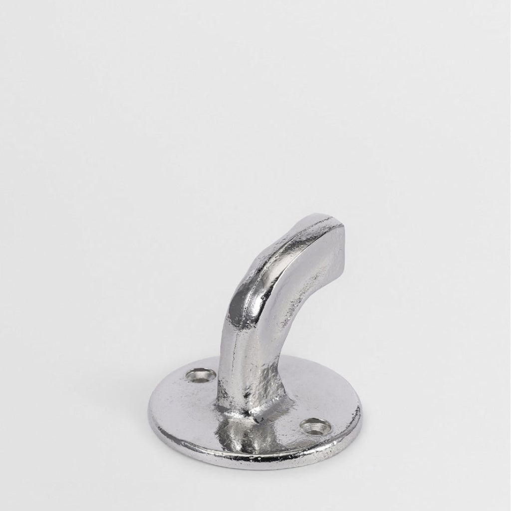Hand-cast nickel finish Forme No. 8 hook with a curved, sculptural profile and textured surface on a white background.