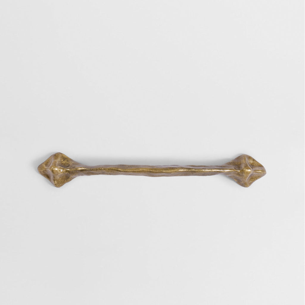 Champagne Bronze Mi & Gei Forme No. 41 large cabinet pull, close-up detail of the cast brass surface.